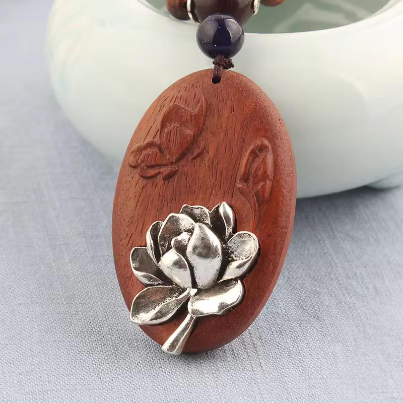 Silver Lotus Bloom Oval Rosewood Pendant Necklace with Carved Leaf Detail