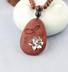Silver Lotus Bloom Oval Rosewood Pendant Necklace with Carved Leaf Detail *