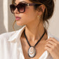 Layered Oval Ring Pendant Necklace with Black Multi-Strand Cord