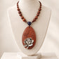 Silver Lotus Bloom Oval Rosewood Pendant Necklace with Carved Leaf Detail