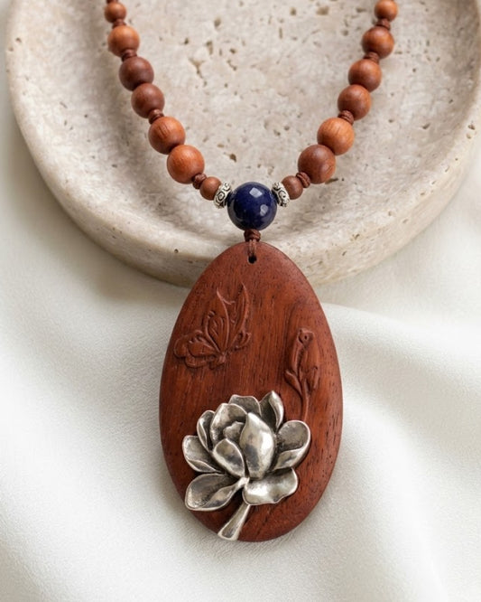 Silver Lotus Bloom Oval Rosewood Pendant Necklace with Carved Leaf Detail
