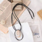 Layered Oval Ring Pendant Necklace with Black Multi-Strand Cord