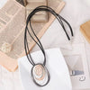 Layered Oval Ring Pendant Necklace with Black Multi-Strand Cord