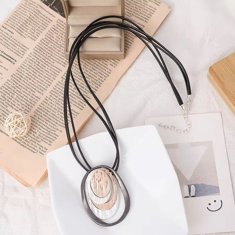 Layered Oval Ring Pendant Necklace with Black Multi-Strand Cord