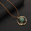 Organic Wire Circle Pendant Necklace with Green Stone on Tan Cord