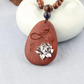 Silver Lotus Bloom Oval Rosewood Pendant Necklace with Carved Leaf Detail *