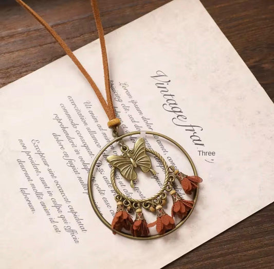 Bronze Butterfly Double Hoop Necklace with Rust Fabric Flower Tassels